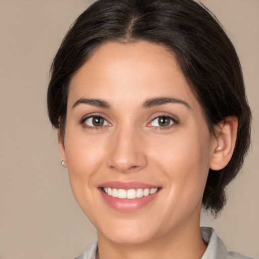 Joyful white young-adult female with medium  brown hair and brown eyes