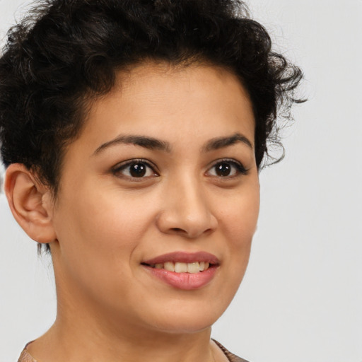 Joyful latino young-adult female with short  brown hair and brown eyes