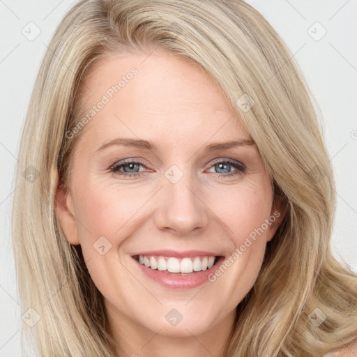 Joyful white young-adult female with long  brown hair and blue eyes