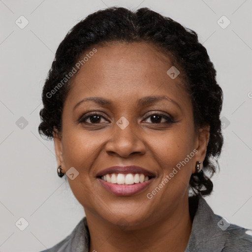 Joyful black young-adult female with medium  brown hair and brown eyes