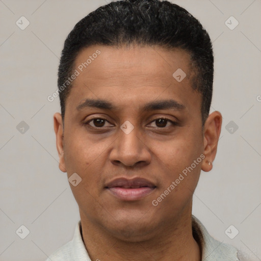 Joyful latino young-adult male with short  black hair and brown eyes