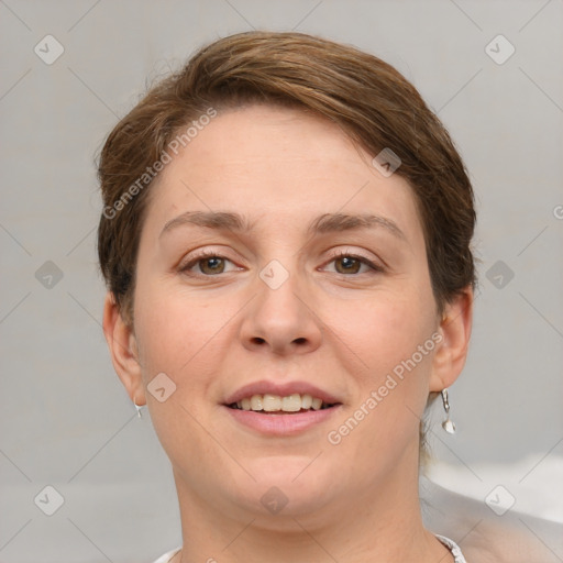 Joyful white young-adult female with short  brown hair and grey eyes