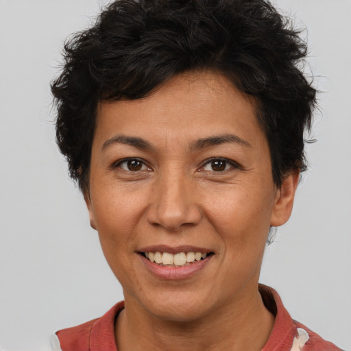 Joyful white adult female with short  brown hair and brown eyes