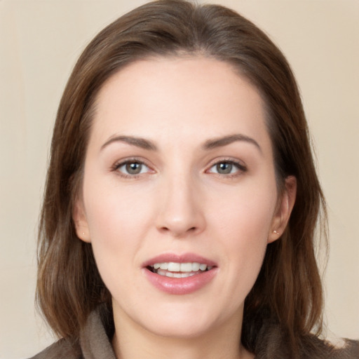 Joyful white young-adult female with medium  brown hair and brown eyes