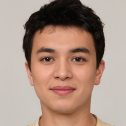 Joyful asian young-adult male with short  brown hair and brown eyes