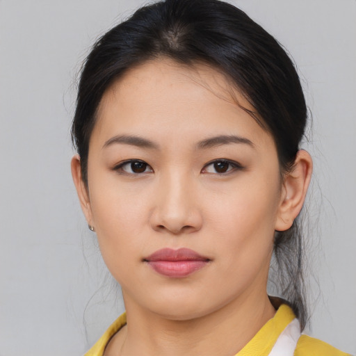 Neutral asian young-adult female with medium  brown hair and brown eyes