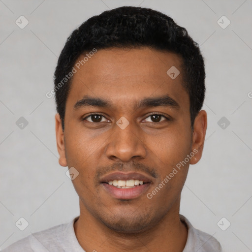 Joyful latino young-adult male with short  black hair and brown eyes