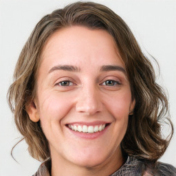 Joyful white young-adult female with medium  brown hair and blue eyes