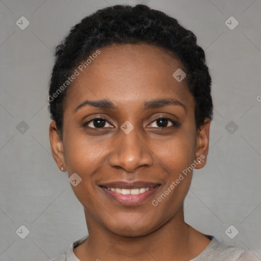 Joyful black young-adult female with short  black hair and brown eyes