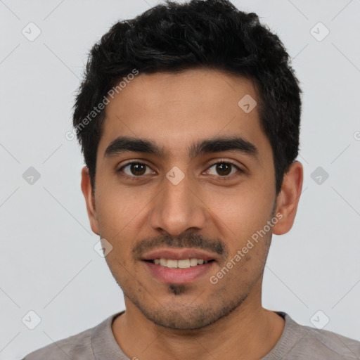 Joyful latino young-adult male with short  black hair and brown eyes