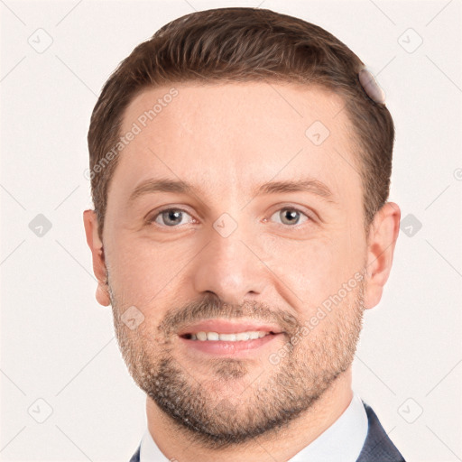 Joyful white young-adult male with short  brown hair and grey eyes