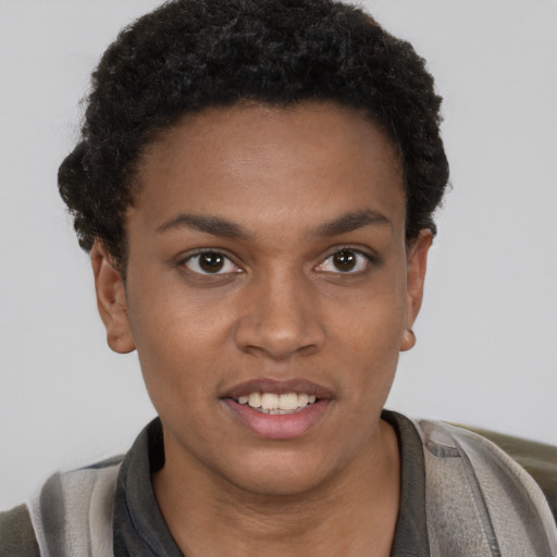 Joyful black young-adult female with short  brown hair and brown eyes