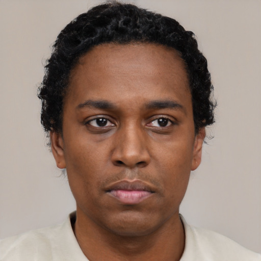 Neutral black young-adult male with short  black hair and brown eyes