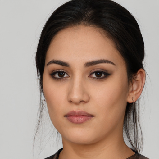 Neutral latino young-adult female with medium  brown hair and brown eyes