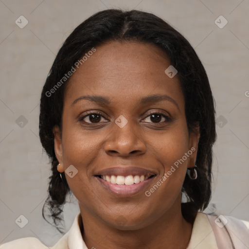 Joyful black young-adult female with medium  brown hair and brown eyes