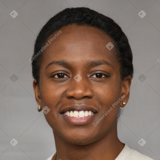 Joyful black young-adult female with short  black hair and brown eyes