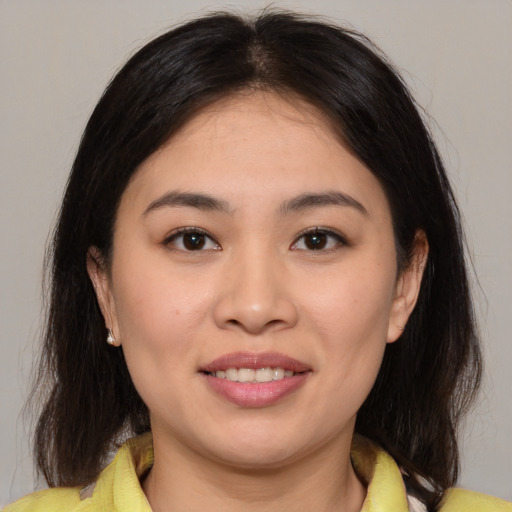 Joyful white young-adult female with medium  brown hair and brown eyes