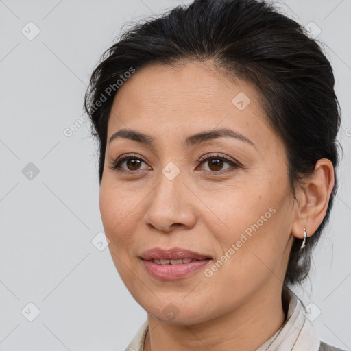 Joyful white adult female with medium  brown hair and brown eyes