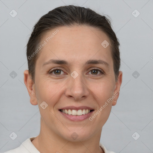 Joyful white adult female with short  brown hair and brown eyes