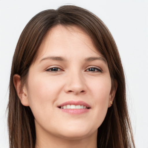 Joyful white young-adult female with long  brown hair and grey eyes