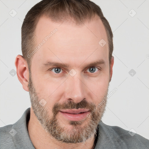 Joyful white adult male with short  brown hair and grey eyes