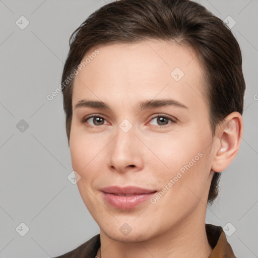 Joyful white young-adult female with short  brown hair and brown eyes