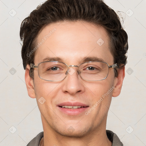 Joyful white adult male with short  brown hair and grey eyes