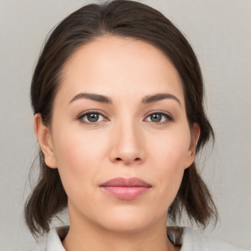 Neutral white young-adult female with medium  brown hair and brown eyes