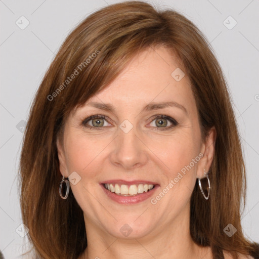 Joyful white adult female with medium  brown hair and grey eyes