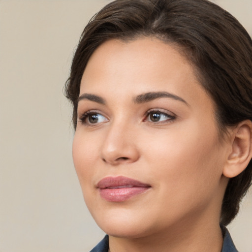 Neutral white young-adult female with medium  brown hair and brown eyes