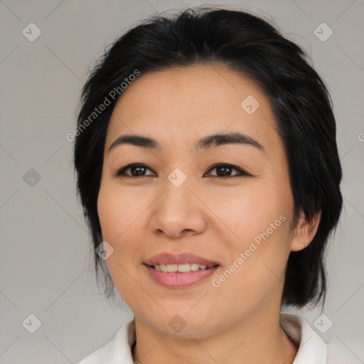 Joyful asian young-adult female with medium  black hair and brown eyes