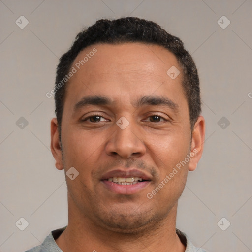 Joyful white adult male with short  black hair and brown eyes