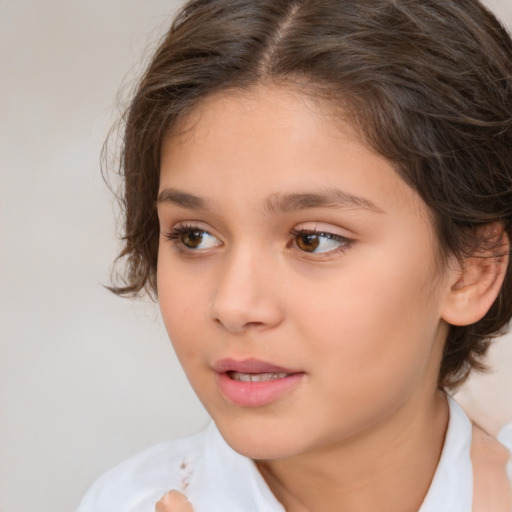 Joyful white child female with medium  brown hair and brown eyes