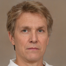 Neutral white middle-aged male with short  blond hair and brown eyes