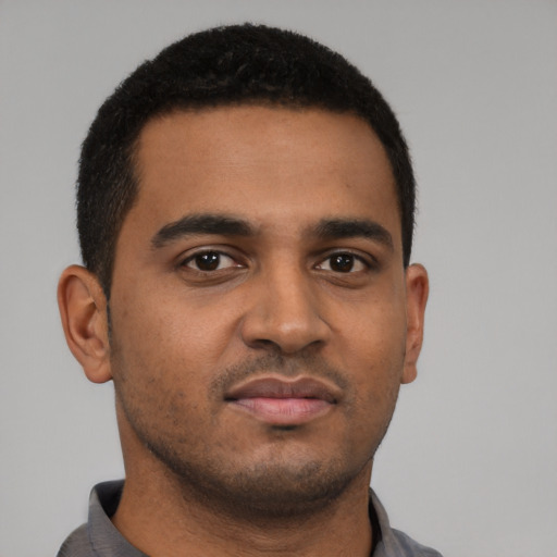 Neutral black young-adult male with short  black hair and brown eyes