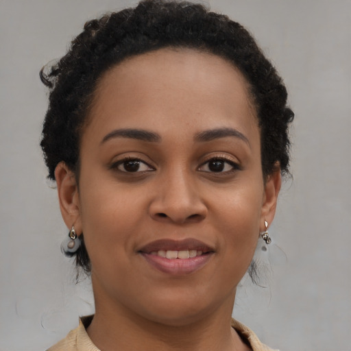 Joyful black young-adult female with short  brown hair and brown eyes