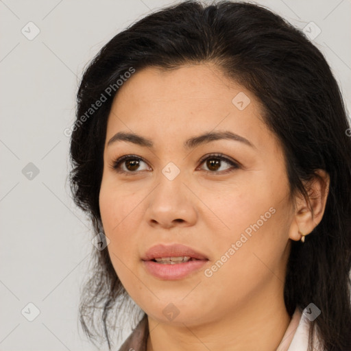 Joyful white adult female with long  brown hair and brown eyes