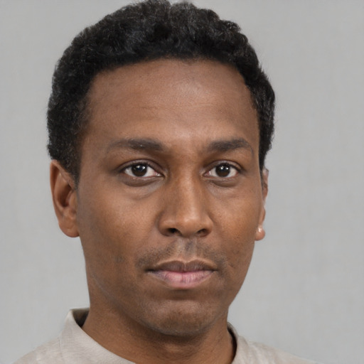 Neutral black young-adult male with short  black hair and brown eyes