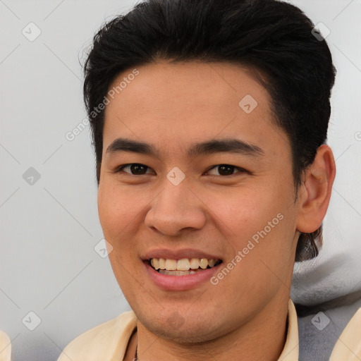 Joyful asian young-adult male with short  brown hair and brown eyes