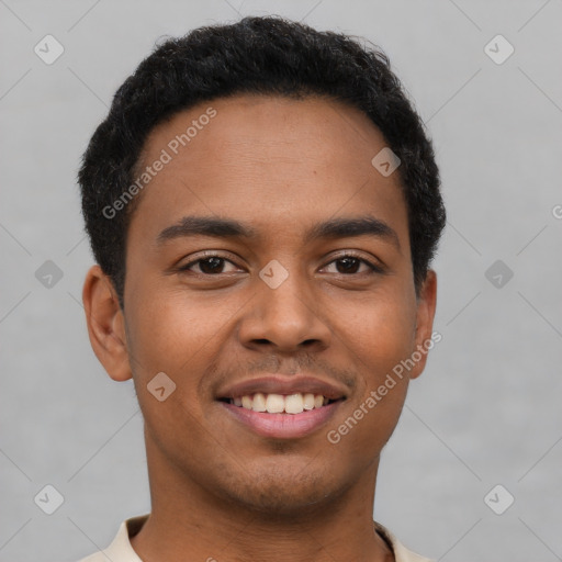 Joyful latino young-adult male with short  brown hair and brown eyes