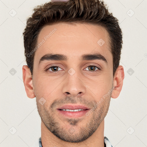 Joyful white young-adult male with short  brown hair and brown eyes