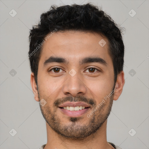 Joyful latino young-adult male with short  black hair and brown eyes