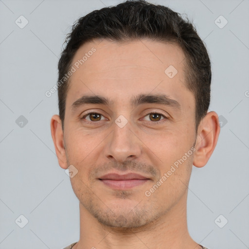 Joyful white young-adult male with short  brown hair and brown eyes