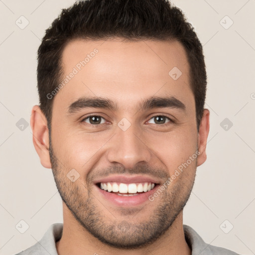 Joyful white young-adult male with short  brown hair and brown eyes