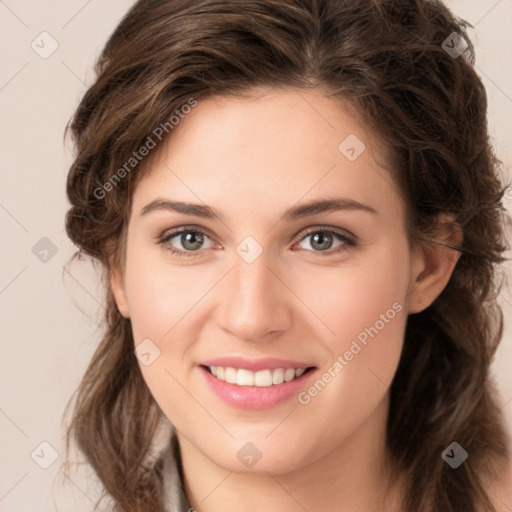 Joyful white young-adult female with long  brown hair and green eyes