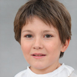 Joyful white child female with short  brown hair and brown eyes