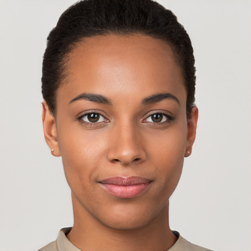 Joyful latino young-adult female with short  brown hair and brown eyes