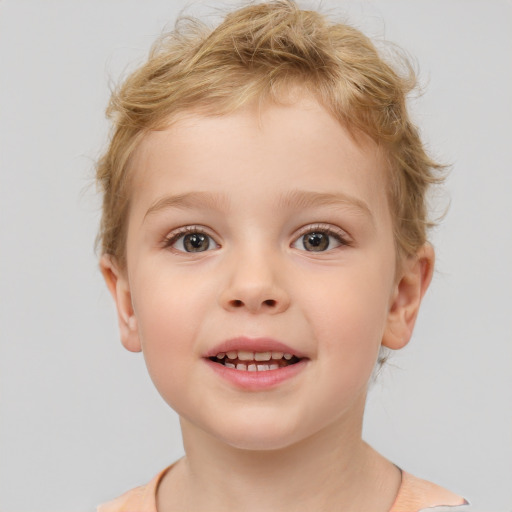 Joyful white child male with short  brown hair and brown eyes