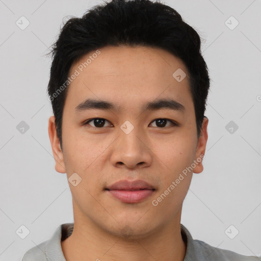 Joyful asian young-adult male with short  black hair and brown eyes