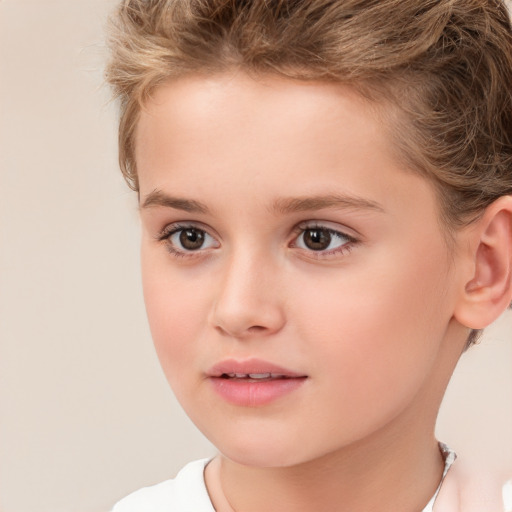 Joyful white child female with short  brown hair and brown eyes